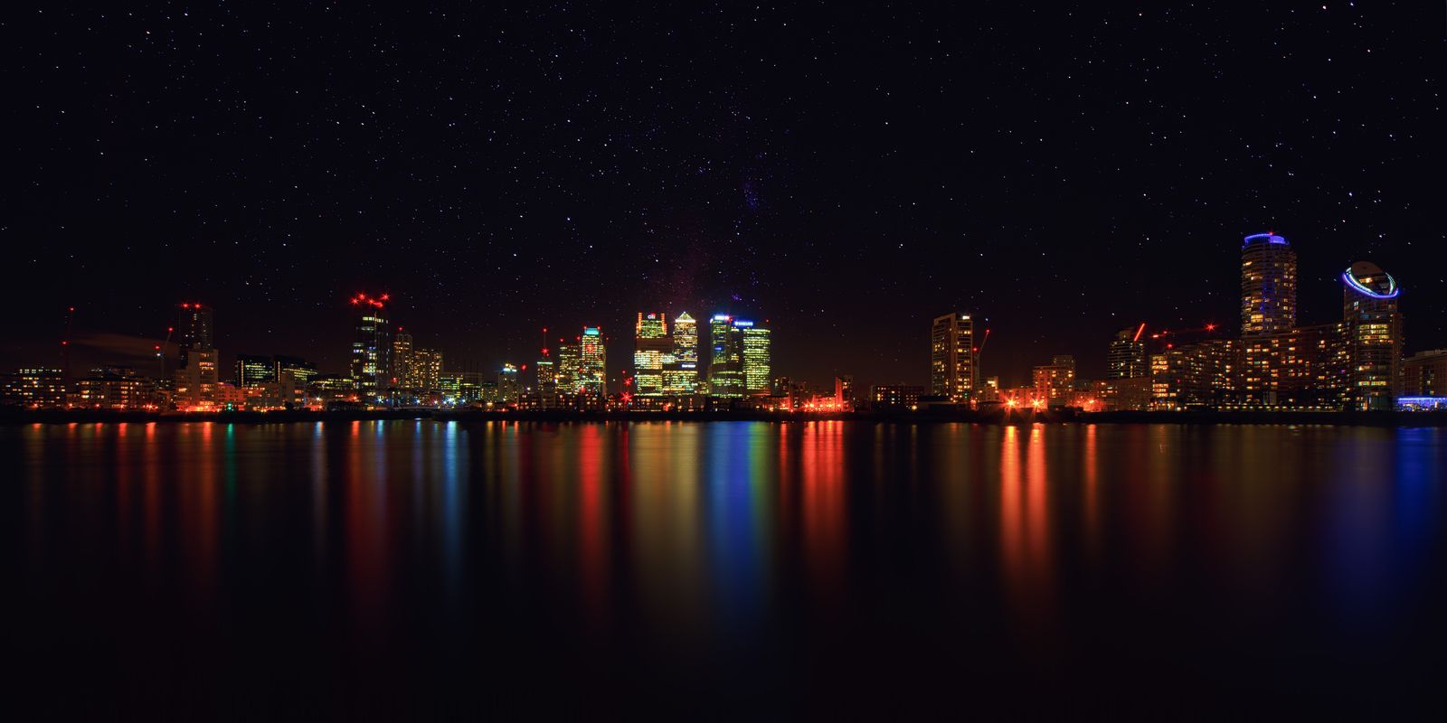 Skyline of a Modern City with Illuminated Buildings at Night — Developers · Monaco: The connected trip: maps, messages and translation, all on one eSIM.