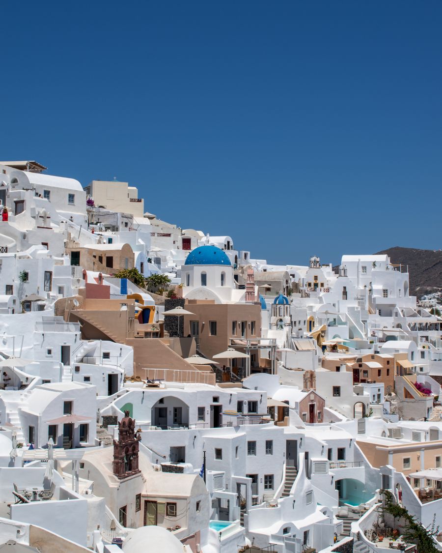 santorini under clear blue sky — Developers · Switzerland: Downtown, connected: the eSIM finds the fastest local network on its own.