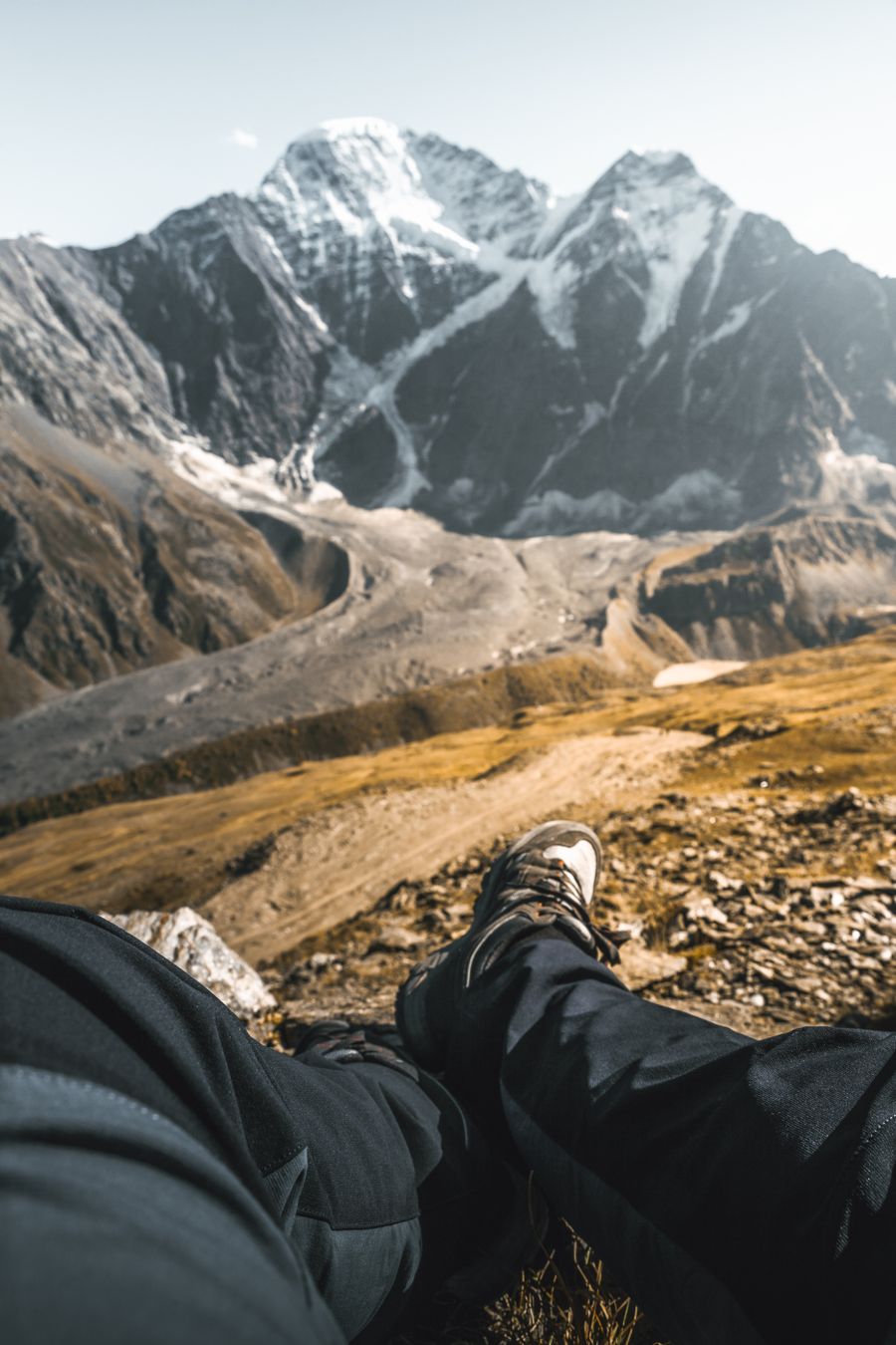person sitting on a mountain — Developers · Tajikistan: Street-food stalls and mobile pay: dinner ordered without a word of the language.