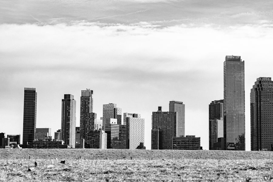 grayscale photograph of high rise buildings in new york — Developers · Mali: Golden hour, fully online — photo backups upload before dinner.
