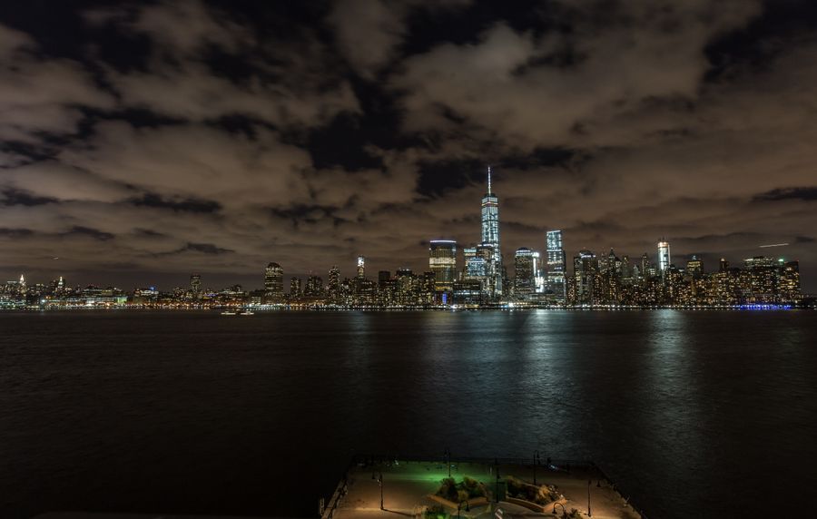 new york cityscape behind sea at night — Developers · Mexico: Travelers stay online from the moment they land — no SIM queues, no roaming shock.