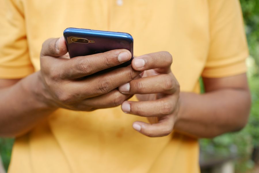 person holding blue smartphone — Developers · Luxembourg: Old town, new tricks: translation apps working in real time.