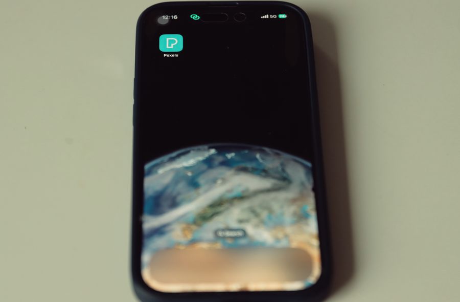 smartphone with earth wallpaper — Developers · Armenia: Every endpoint returns the same shape — learn one, know them all.