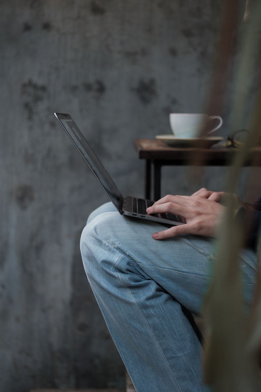 close up of man working on laptop — Developers · Barbados: The API issues eSIMs the way your app issues everything else — over HTTPS.