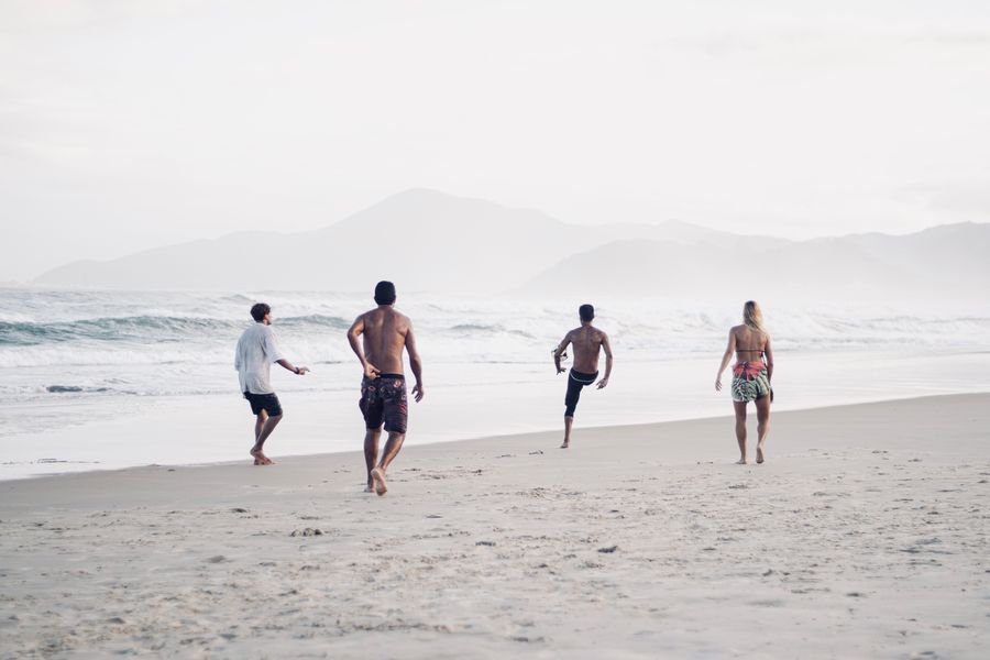 a group of men on the beach playing soccer — Developers · Burkina Faso: The API issues eSIMs the way your app issues everything else — over HTTPS.