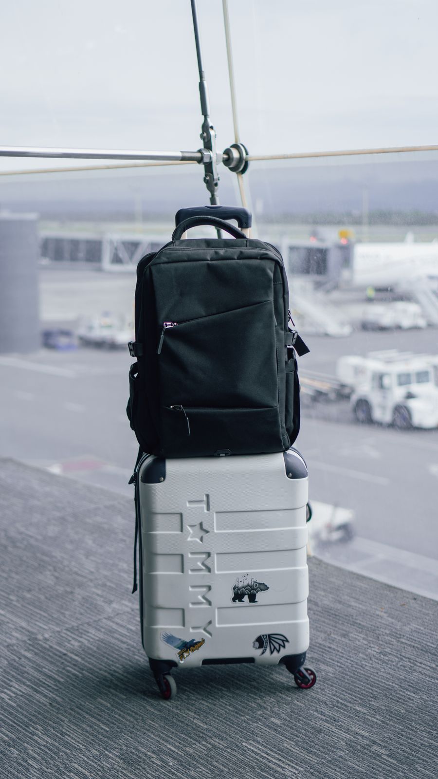 backpack on suitcase on airport — Developers · Haiti: The welcome home: eSIM deleted in one tap, no contract to cancel.