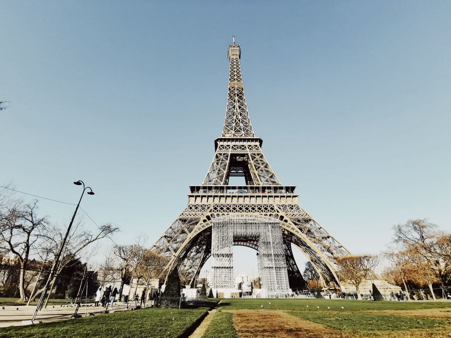 low angle shot of the eiffel tower against blue sky — Developers · Nauru: Webhooks tell you when data runs low, plans expire, top-ups land.