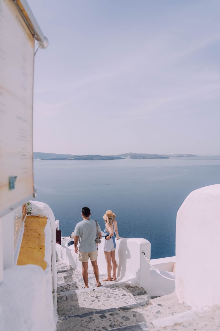 couple walking down the stairs in santorini greece — Developers · Greece: Trailheads and lookouts: offline maps downloaded, just in case.