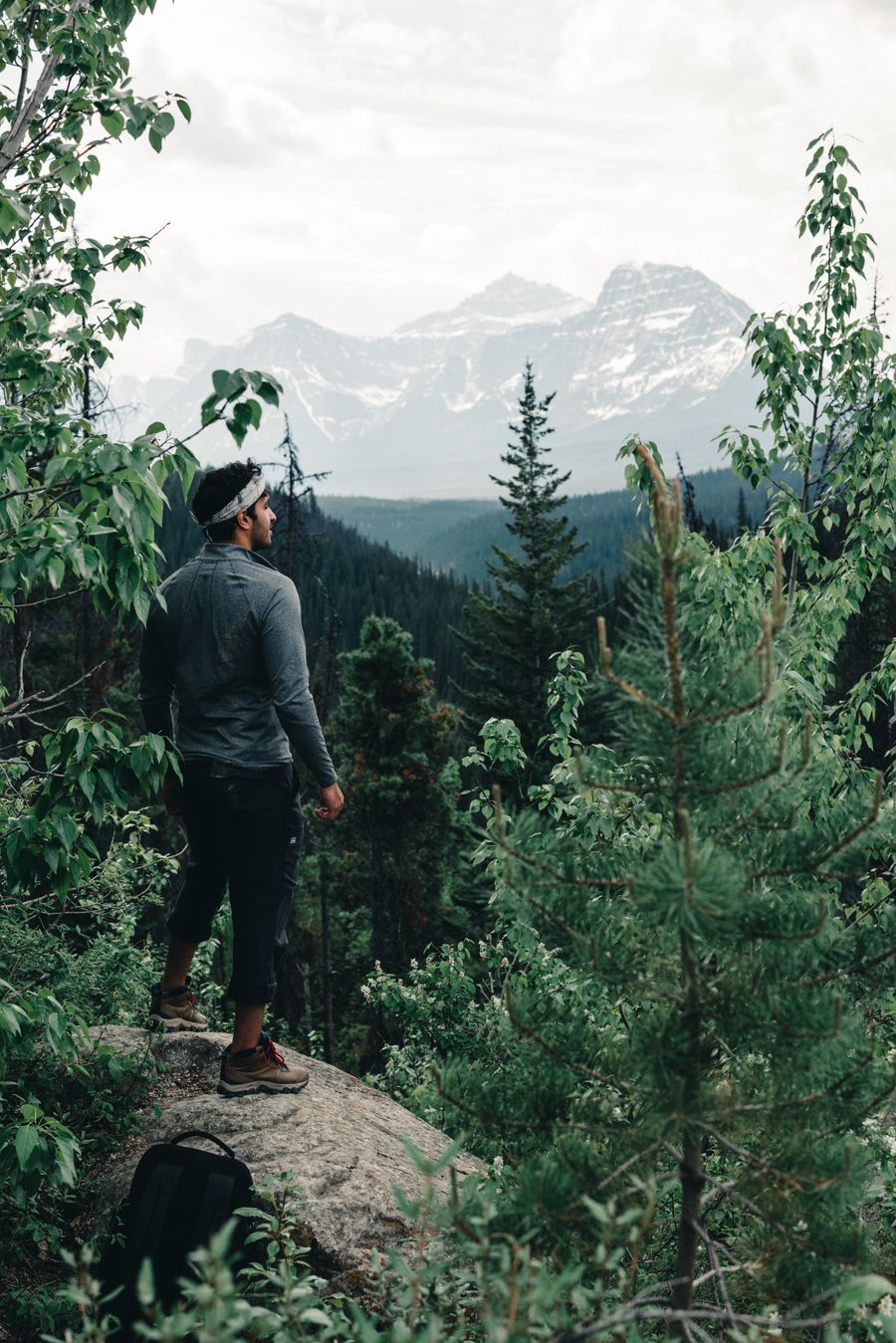 a man standing on a rock looking at the mountains — Developers · Lesotho: Family group chat: location shared, dinner plans settled in minutes.