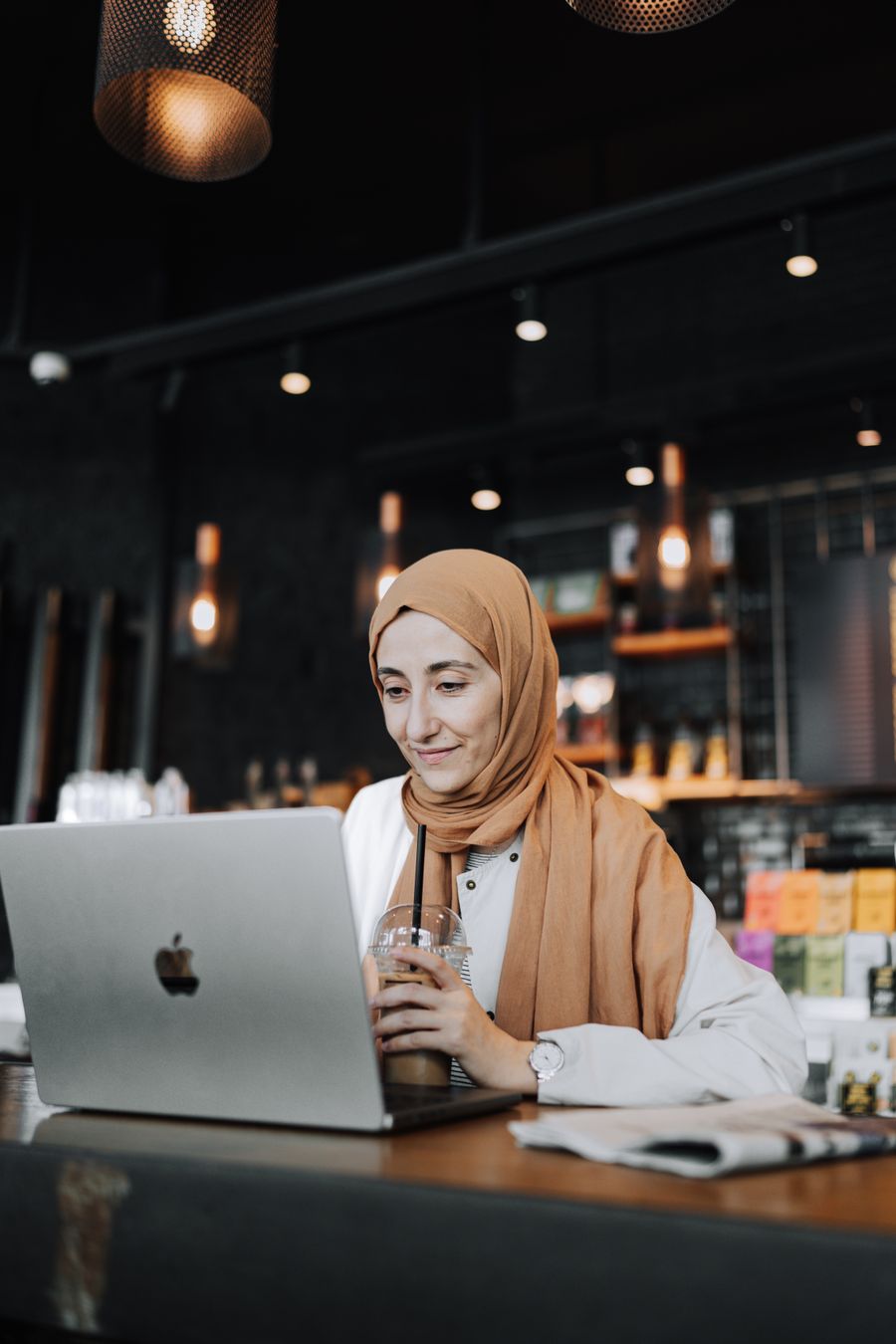 woman using laptop at cafe — Developers · Bosnia and Herzegovina: Harbor views with full bars: coverage where travelers actually go.