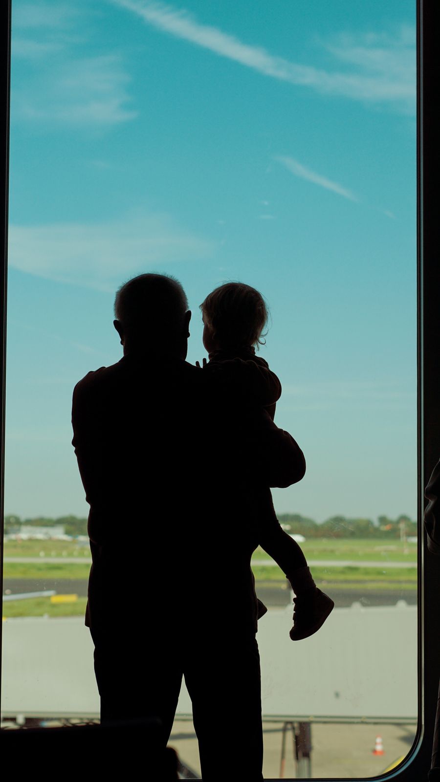 a man and child are silhouetted against an airport window — Developers · Samoa: Trailheads and lookouts: offline maps downloaded, just in case.