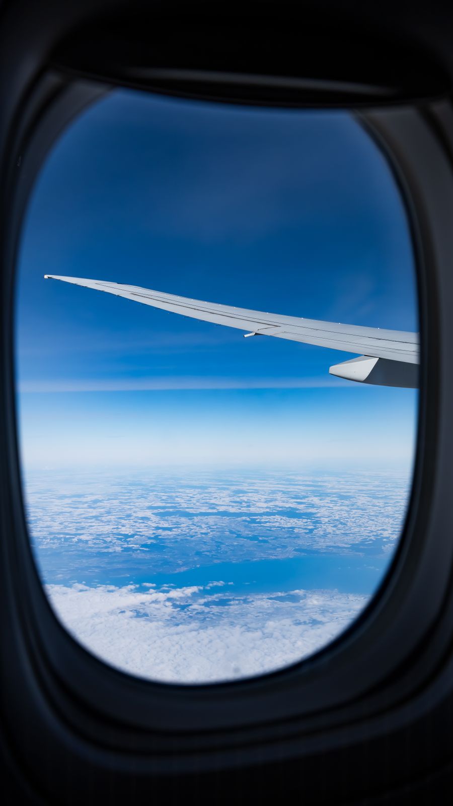 wing of flying airplane — Developers · Monaco: The business trip: client deck synced, video call joined from the taxi.