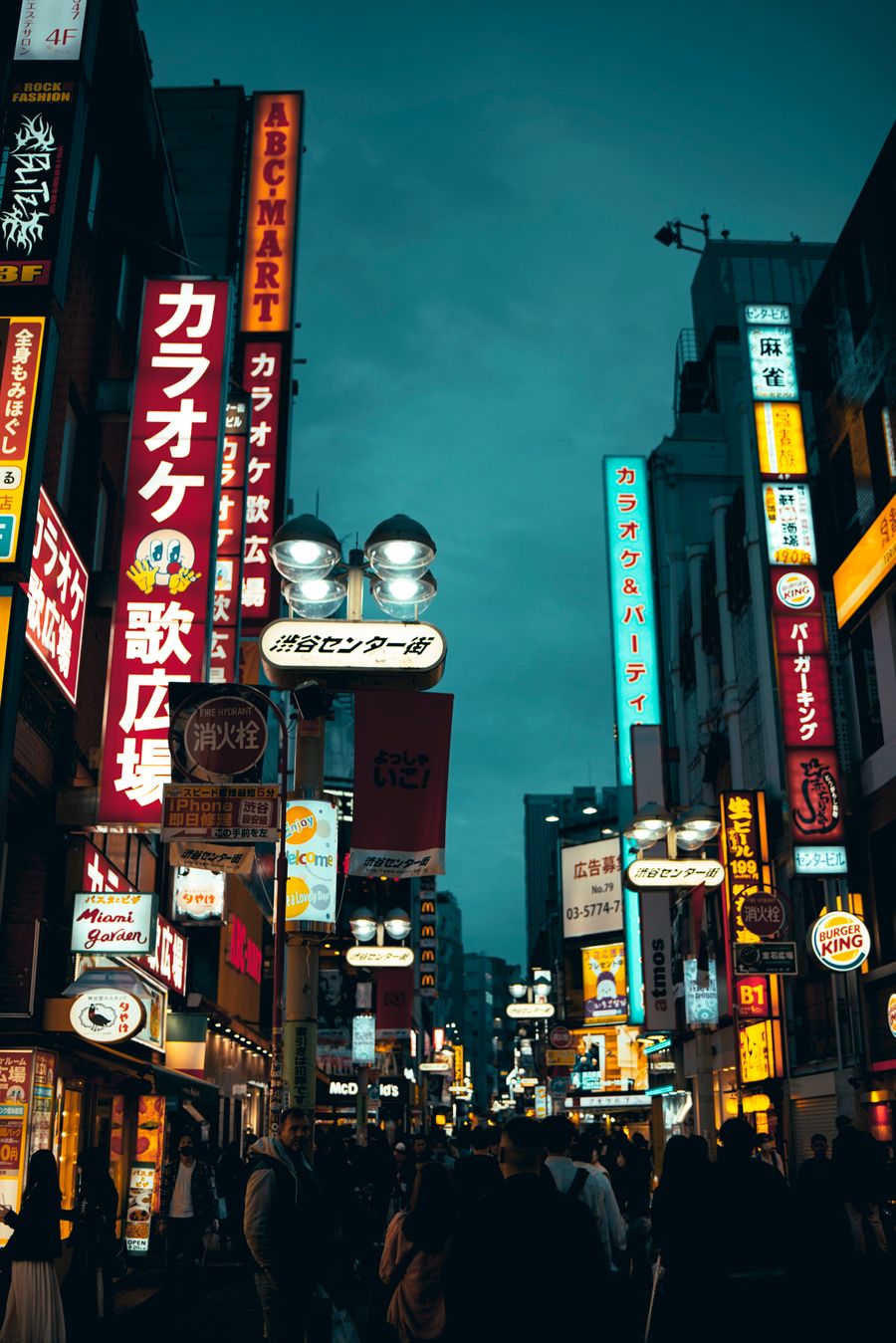 pedestrians walk street in asian city at night — Developers · Ecuador: Platform to platform: tickets, timetables and taxis in one hand.