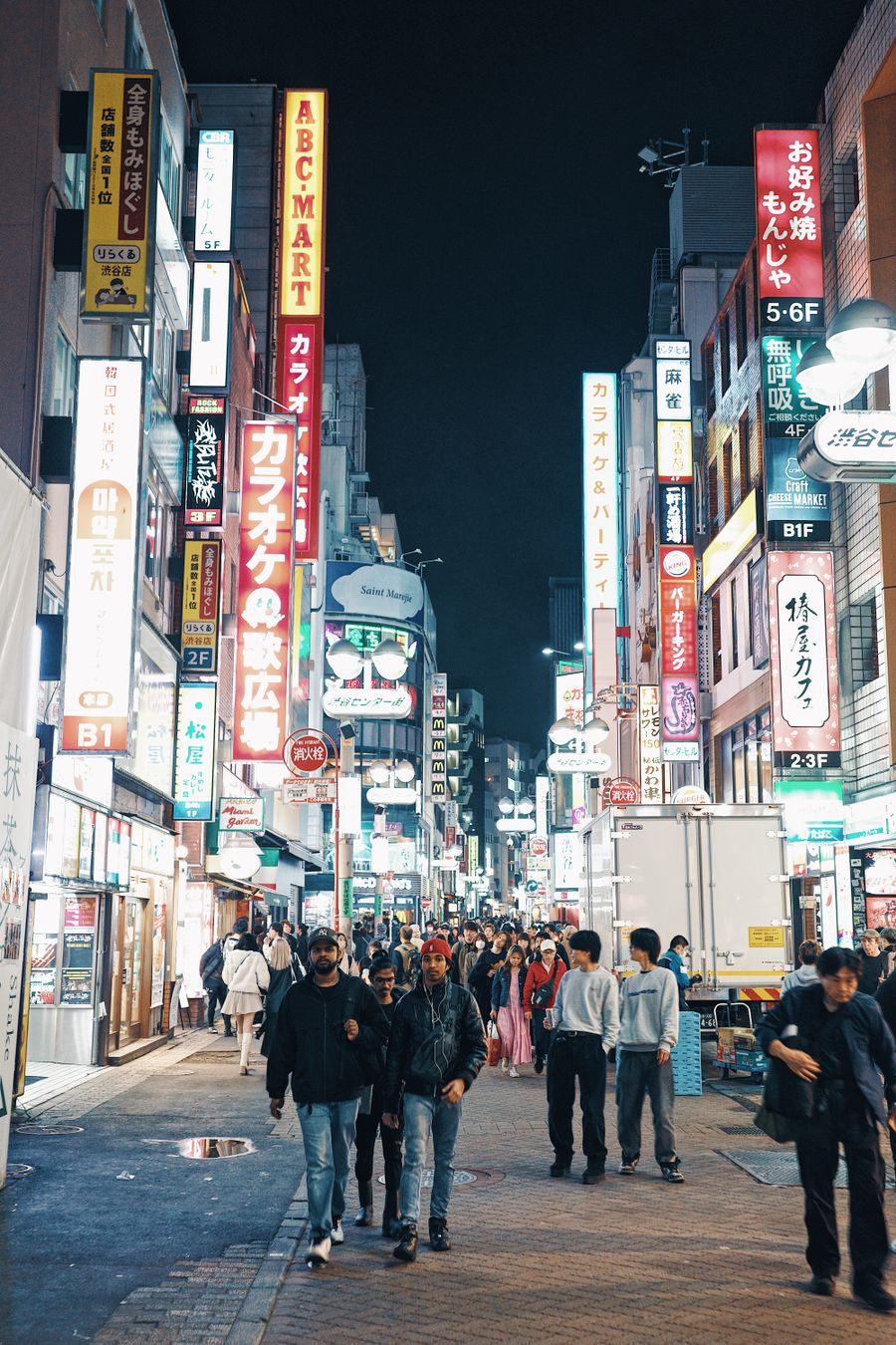view of a crowded shibuya district at night tokyo japan — Developers · Cabo Verde: The food tour: every recommendation looked up on the spot.