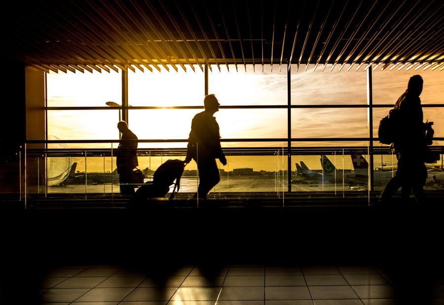 silhouette of person in airport — Developers · DR Congo: Souvenir hunting with live currency conversion in your pocket.