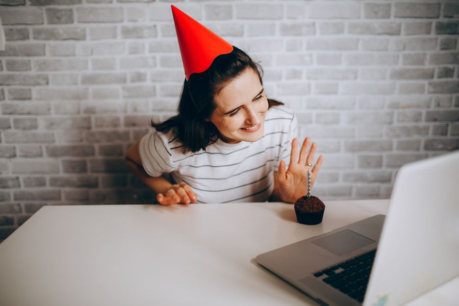 woman with red cap talking on laptop — Developers · Estonia: One curl call provisions a Estonia eSIM — 200 OK in milliseconds.