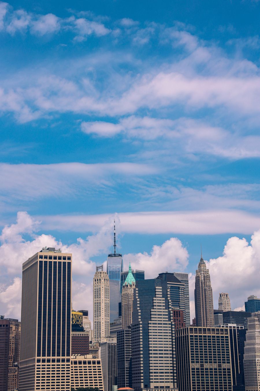 a view of the city skyline with a blue sky