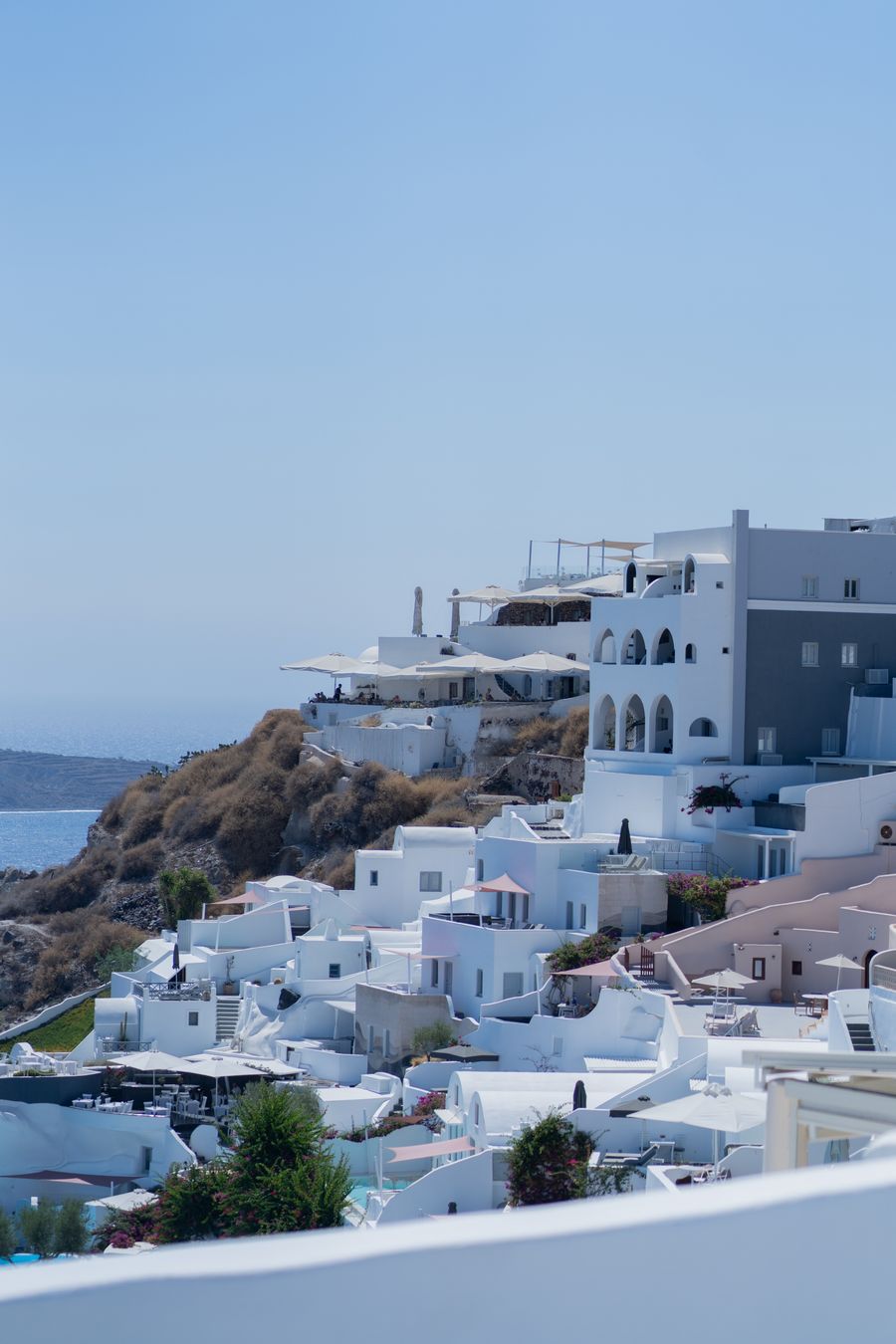 the view from the top of a hill overlooking the ocean — Developers · Malta: The business trip: client deck synced, video call joined from the taxi.