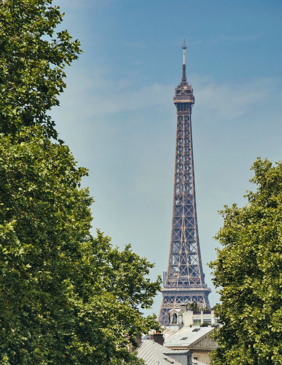eiffel tower in paris framed by lush greenery — Developers · Sudan: Rain or shine, the connection holds — weather doesn't throttle data.