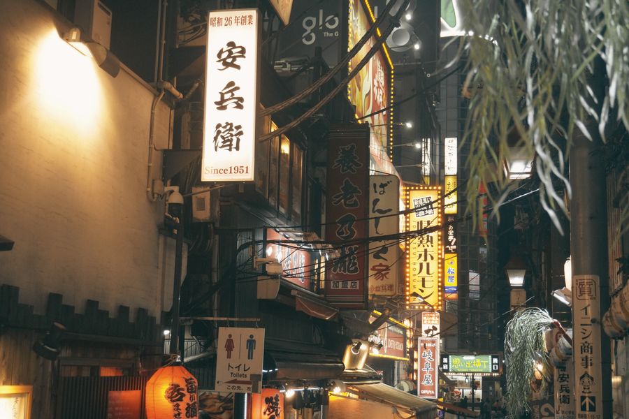 bustling night street scene in tokyo japan