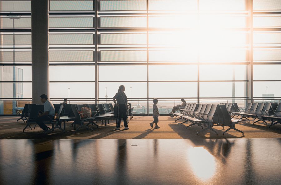 modern airport terminal with travelers at sunrise — Developers · Switzerland: The status page is public — uptime you can verify, not claim.