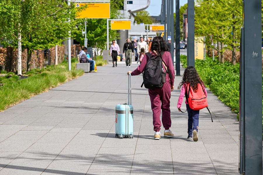 mother and daughter walking at eindhoven airport — Developers · Benin: Every endpoint returns the same shape — learn one, know them all.