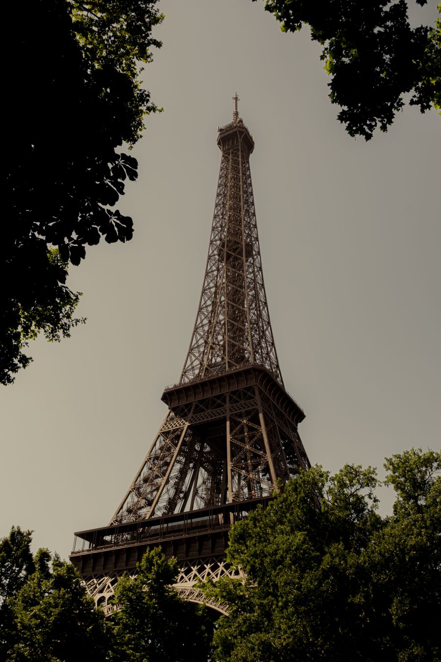 iconic eiffel tower in summer foliage — Developers · the Philippines: The red-eye recovery: hotel early-check-in arranged mid-flight.