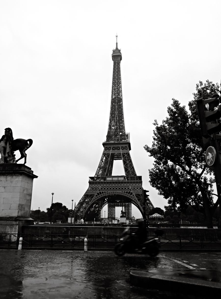 moody eiffel tower view on a rainy day — Developers · Denmark: Hiking the ridge: trail map offline, emergency numbers saved.