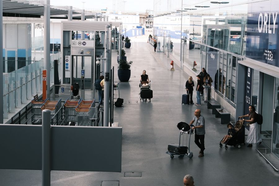 busy airport terminal with travelers and luggage — Developers · Paraguay: Museum afternoons with audio guides streaming, not buffering.