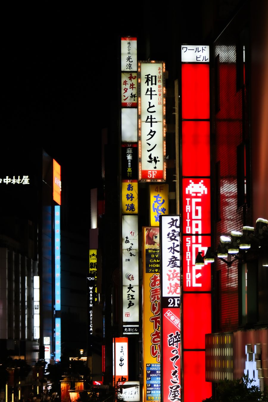vibrant tokyo nightlife with neon signs — Developers · Lithuania: The commute, handled: podcasts downloaded, messages sent, no dead zones.