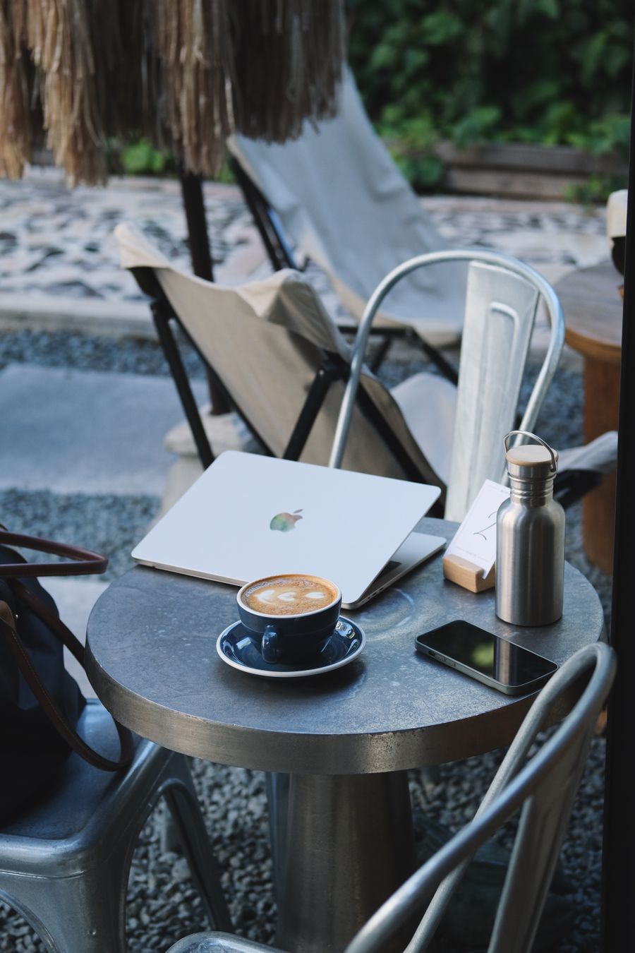 outdoor workspace with coffee and laptop — Developers · Central African Republic: City lights after dark — the eSIM doesn't care what time it is.