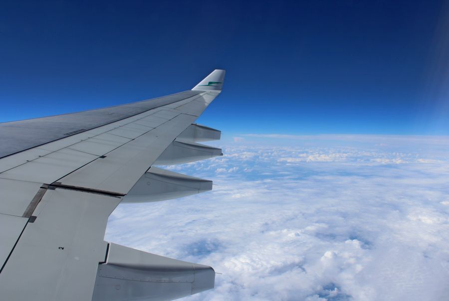 airplane wing above the clouds — Developers · Central African Republic: Currency exchange, skipped: the phone pays at the real rate.