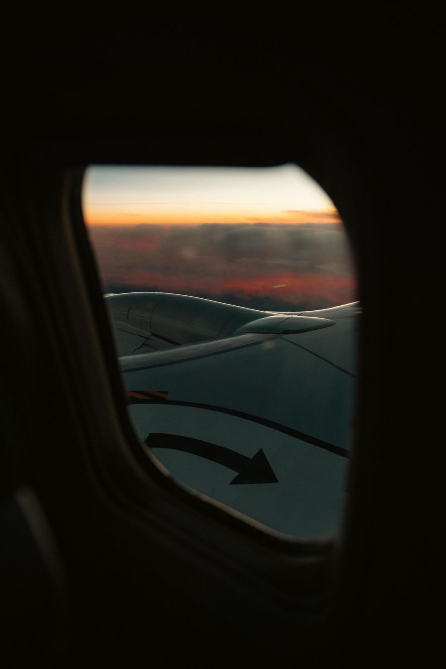 view from airplane window at sunset — Developers · Ecuador: Check-in lines move faster when your documents are on your phone.