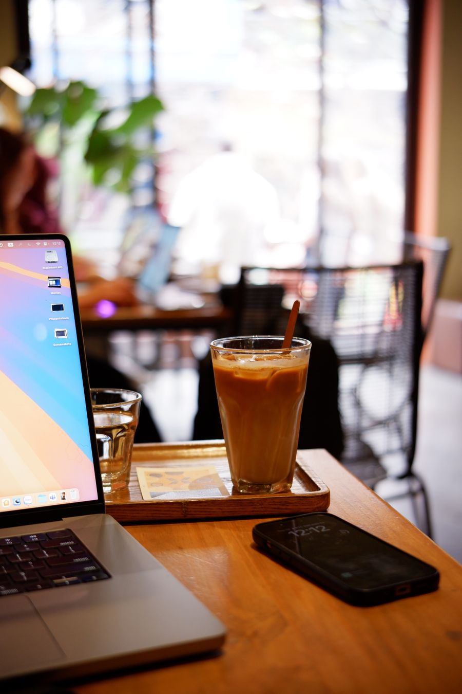 iced coffee on wooden table in modern cafe — Developers · Lesotho: Street-food stalls and mobile pay: dinner ordered without a word of the language.