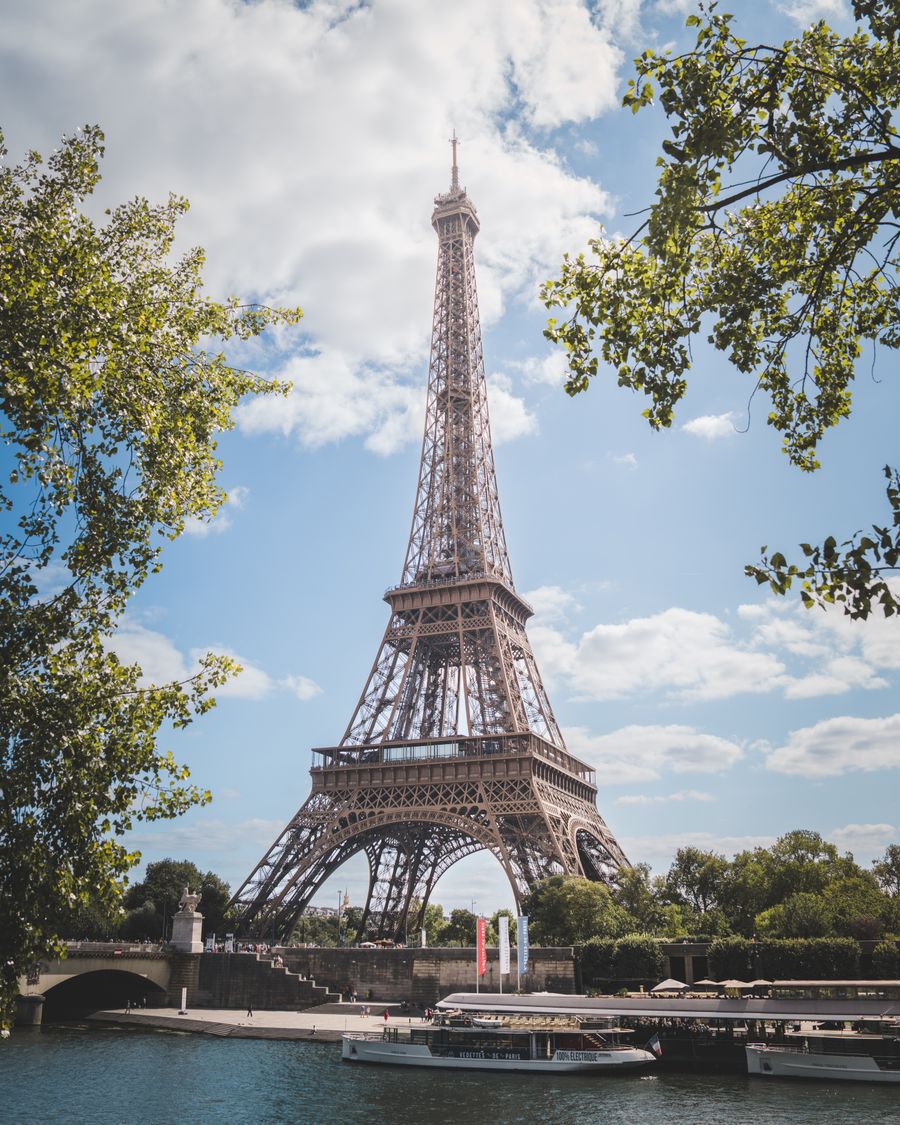 eiffel tower in paris on a sunny day — Developers · the Philippines: Check-in lines move faster when your documents are on your phone.