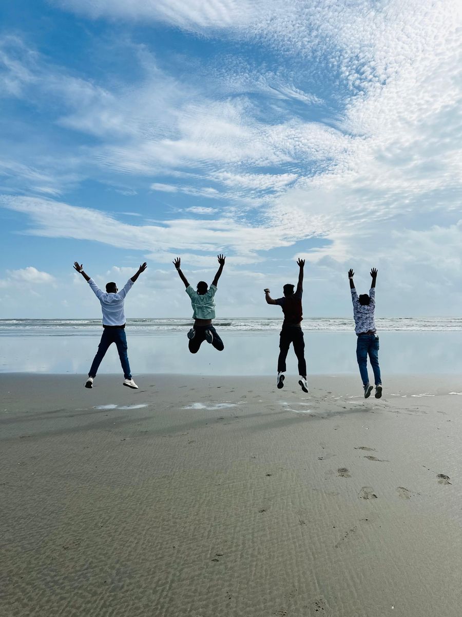 friends jumping together on a beach — Developers · Barbados: Café office: hotspot running, video call stable, no hotel Wi-Fi roulette.