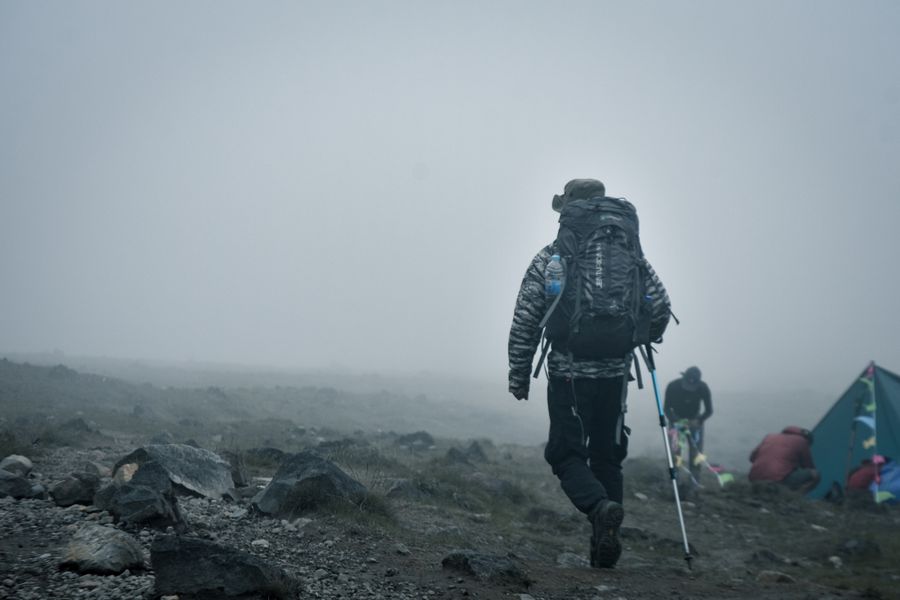 adventurer hiking in foggy mountain landscape — Developers · Canada: Currency exchange, skipped: the phone pays at the real rate.