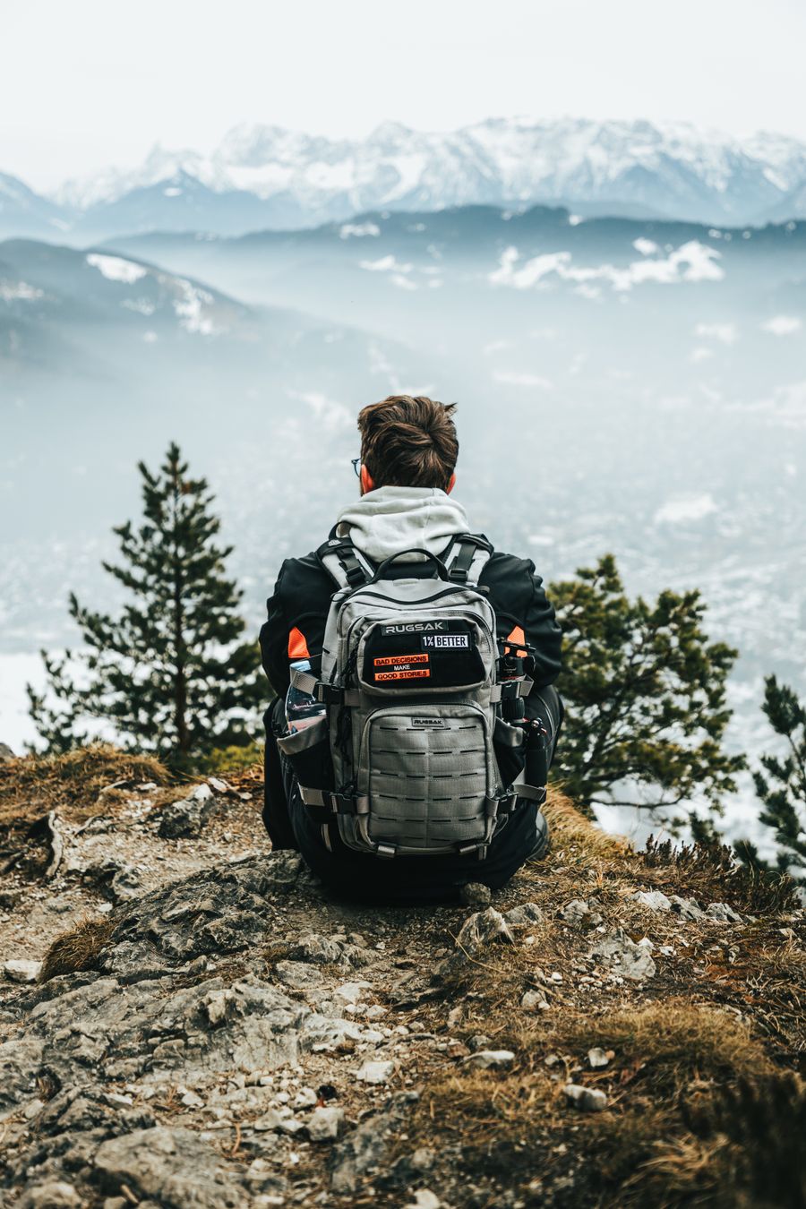 hiker with backpack exploring mountain view