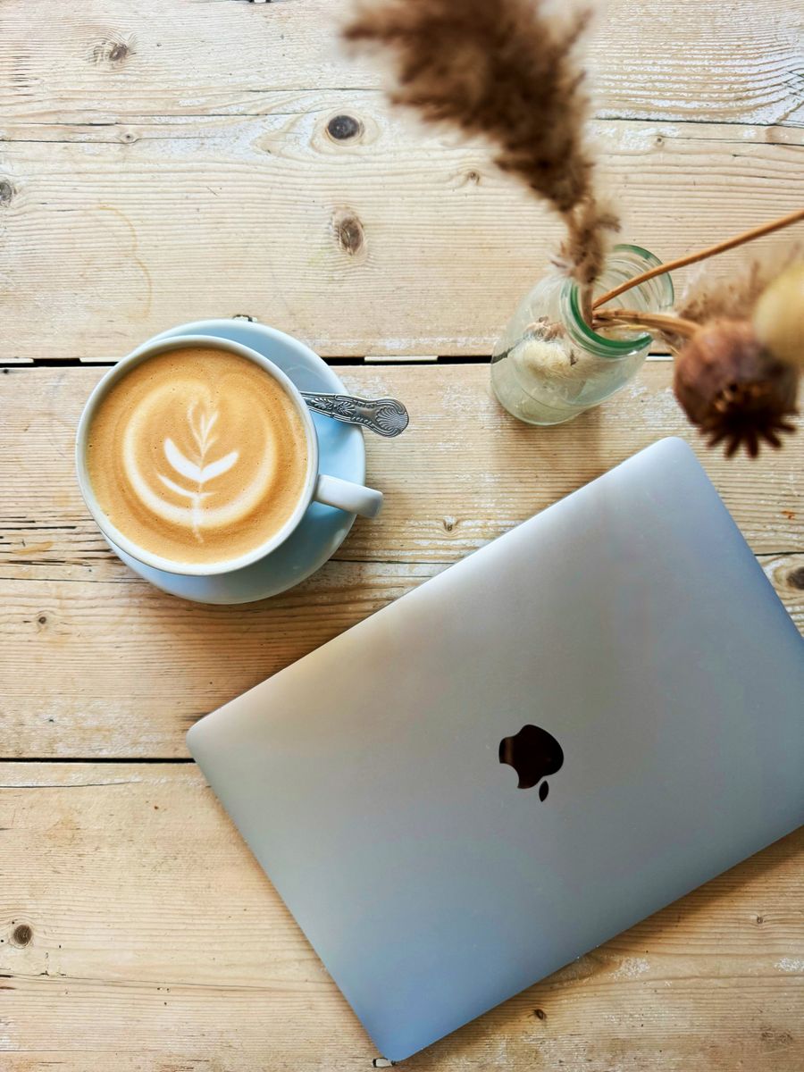 cozy cafe workspace with laptop and latte art — Developers · Lesotho: Border crossings without the paperwork shuffle: ID photos stored on the phone.