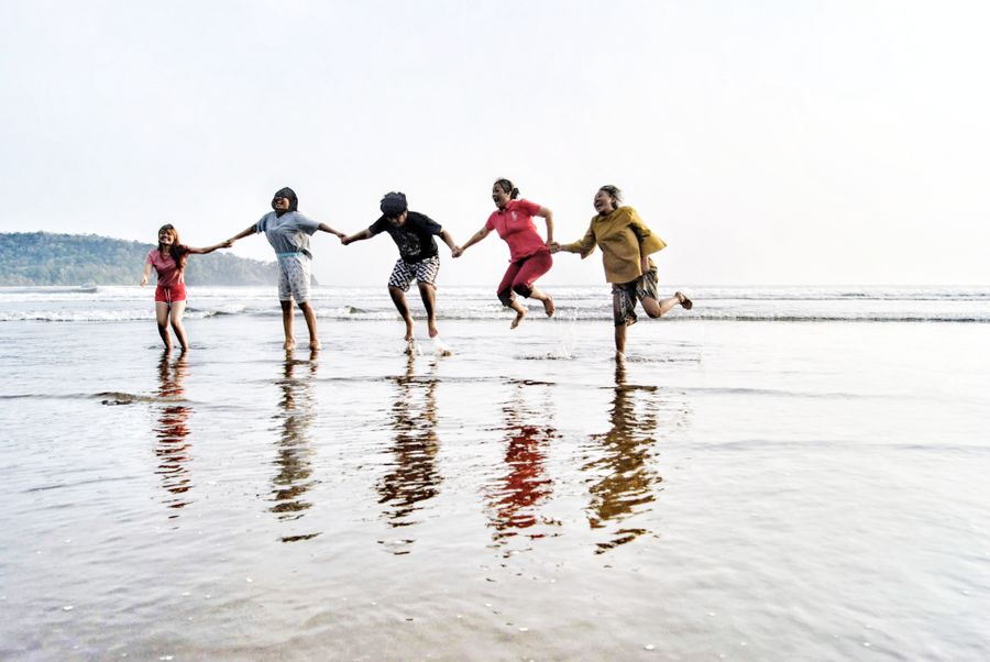 group of friends enjoying the beach in pangandaran