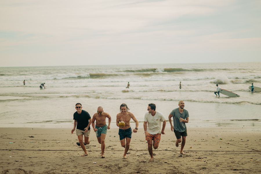 group of friends enjoying a beach day — Developers: The API issues eSIMs the way your app issues everything else — over HTTPS.