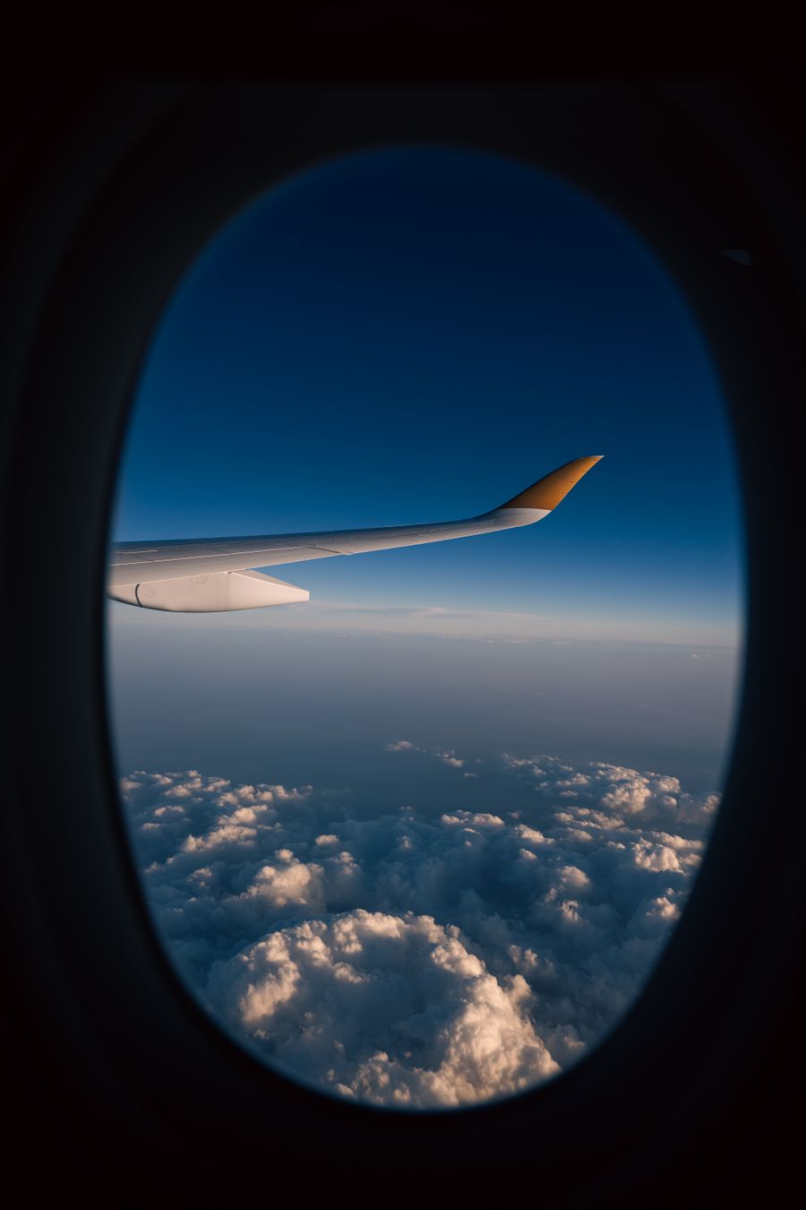 view from airplane window with cloudscape — Developers · Belgium: The viewpoint at golden hour: livestream the sunset to everyone back home.