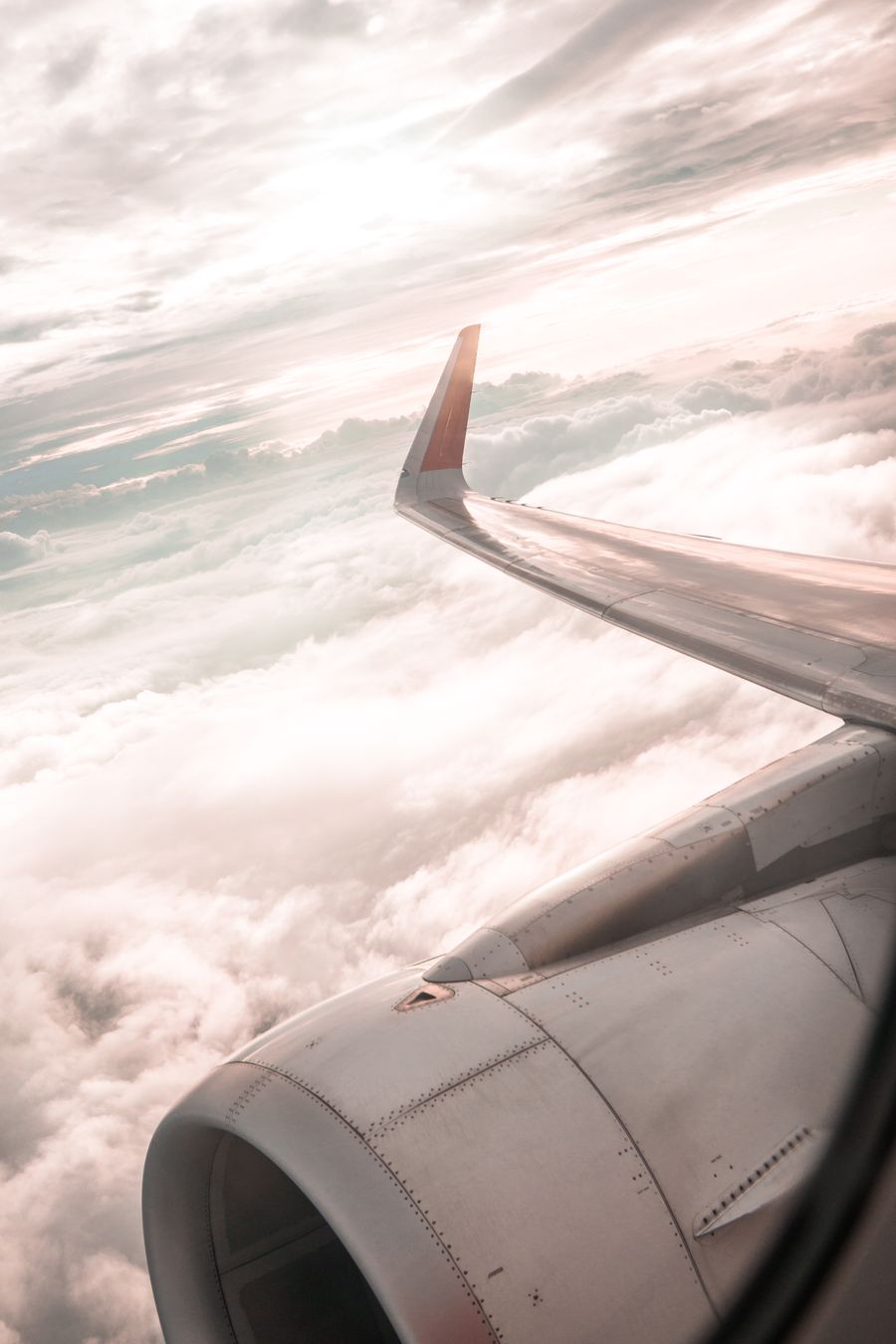 airplane over white clouds — Developers · DR Congo: The commute, handled: podcasts downloaded, messages sent, no dead zones.