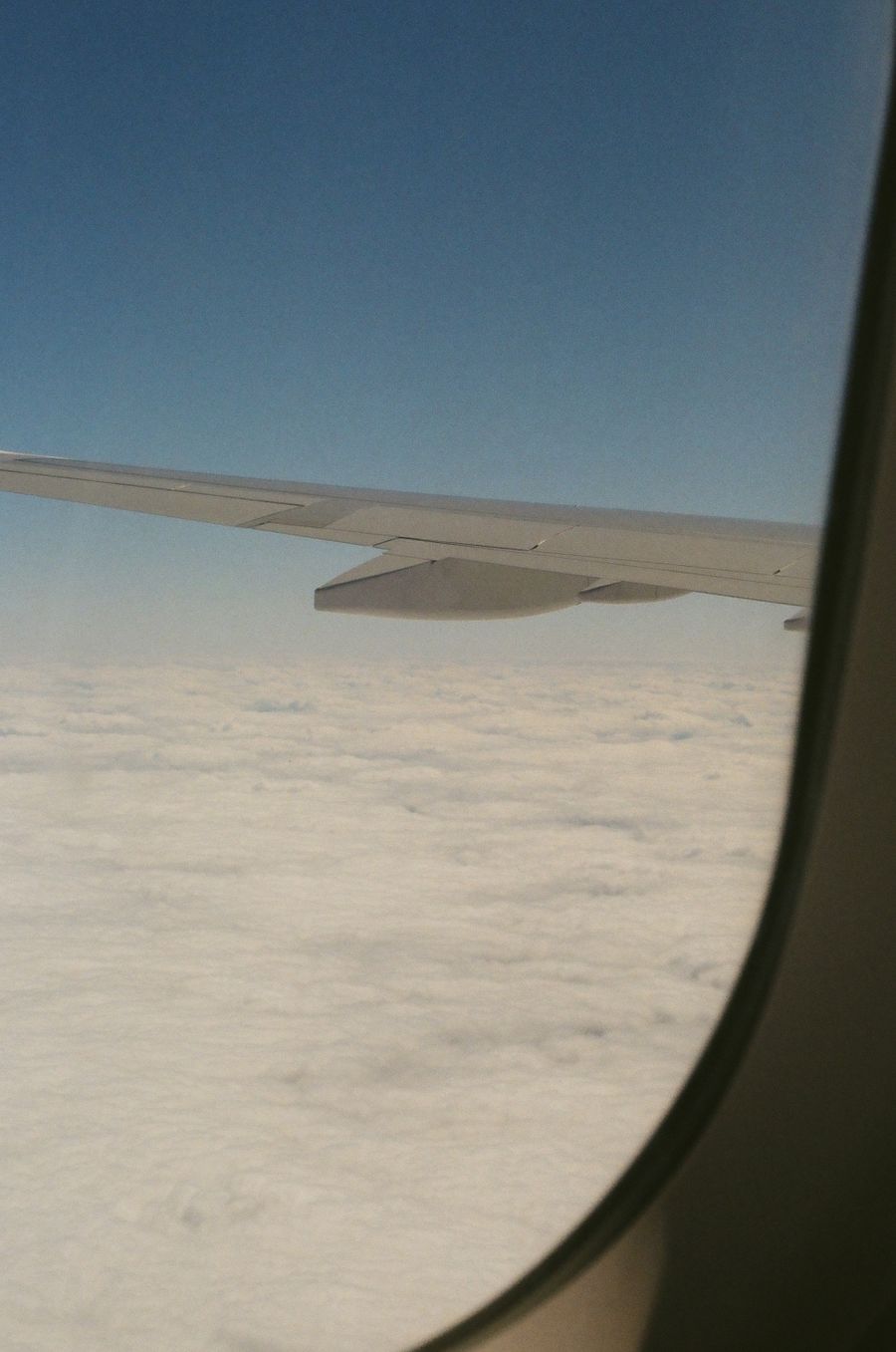 aerial view from plane window showing clouds