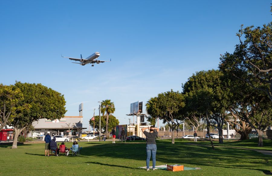 airplane landing over park visitors — Developers · Cameroon: Night markets and late trains — connected the whole way through.
