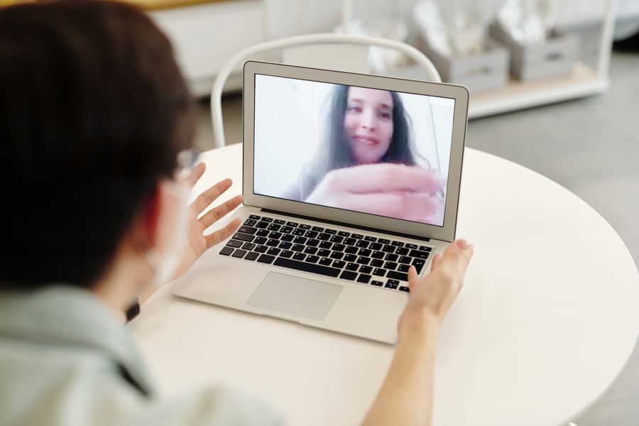 woman having a video call — Developers · Cuba: The docs ship with runnable examples, not pseudocode.