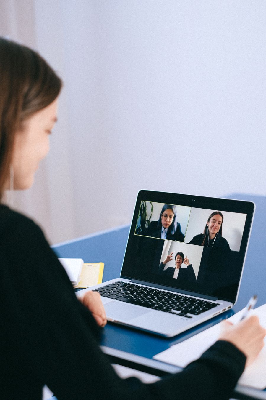 people on a video call — Developers · Andorra: The window seat office: emails sent somewhere over the ocean.