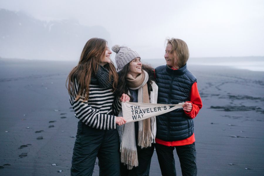 smiling women on beach in fog — Developers · Grenada: Souvenir hunting with live currency conversion in your pocket.