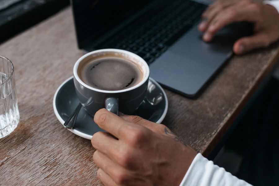 close up shot of a person holding a tea cup — Developers · Mali: Street-food stalls and mobile pay: dinner ordered without a word of the language.