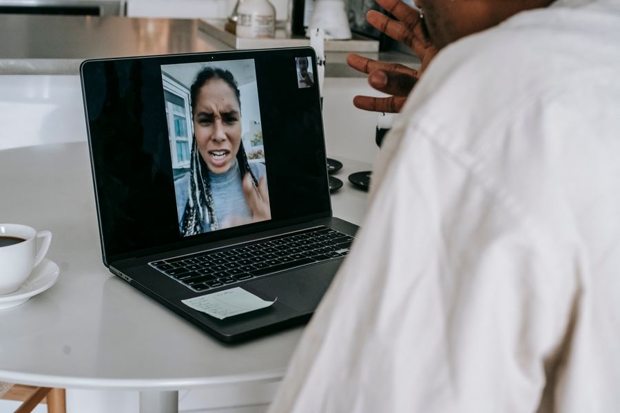 unrecognizable ethnic man having video conference with upset girlfriend — Developers · Saint Kitts and Nevis: The commute, handled: podcasts downloaded, messages sent, no dead zones.